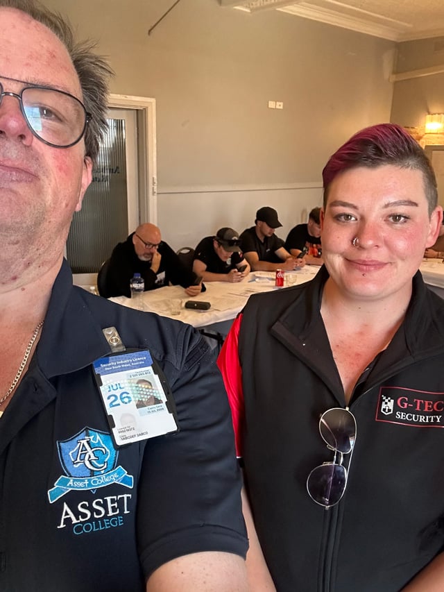 Katelyn alongside her trainer at Asset College